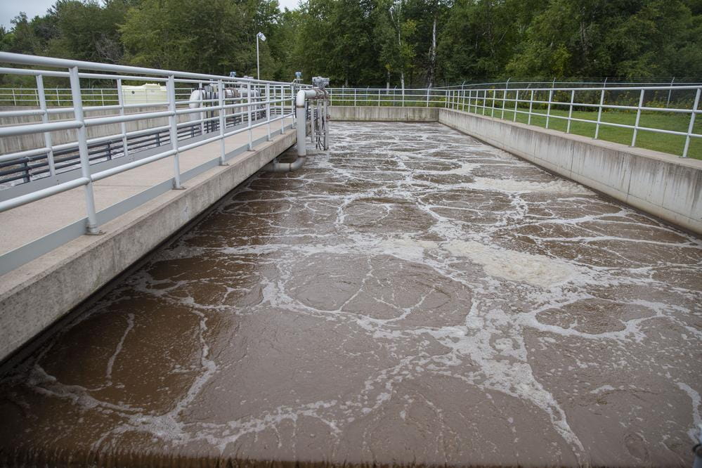 A vat of brown wastewater