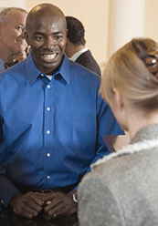 Man smiling at bank teller