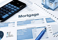 Mortgage paperwork with charts and graphs