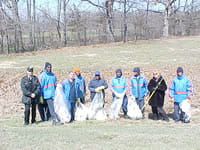 Clean-up crews along the side of the road