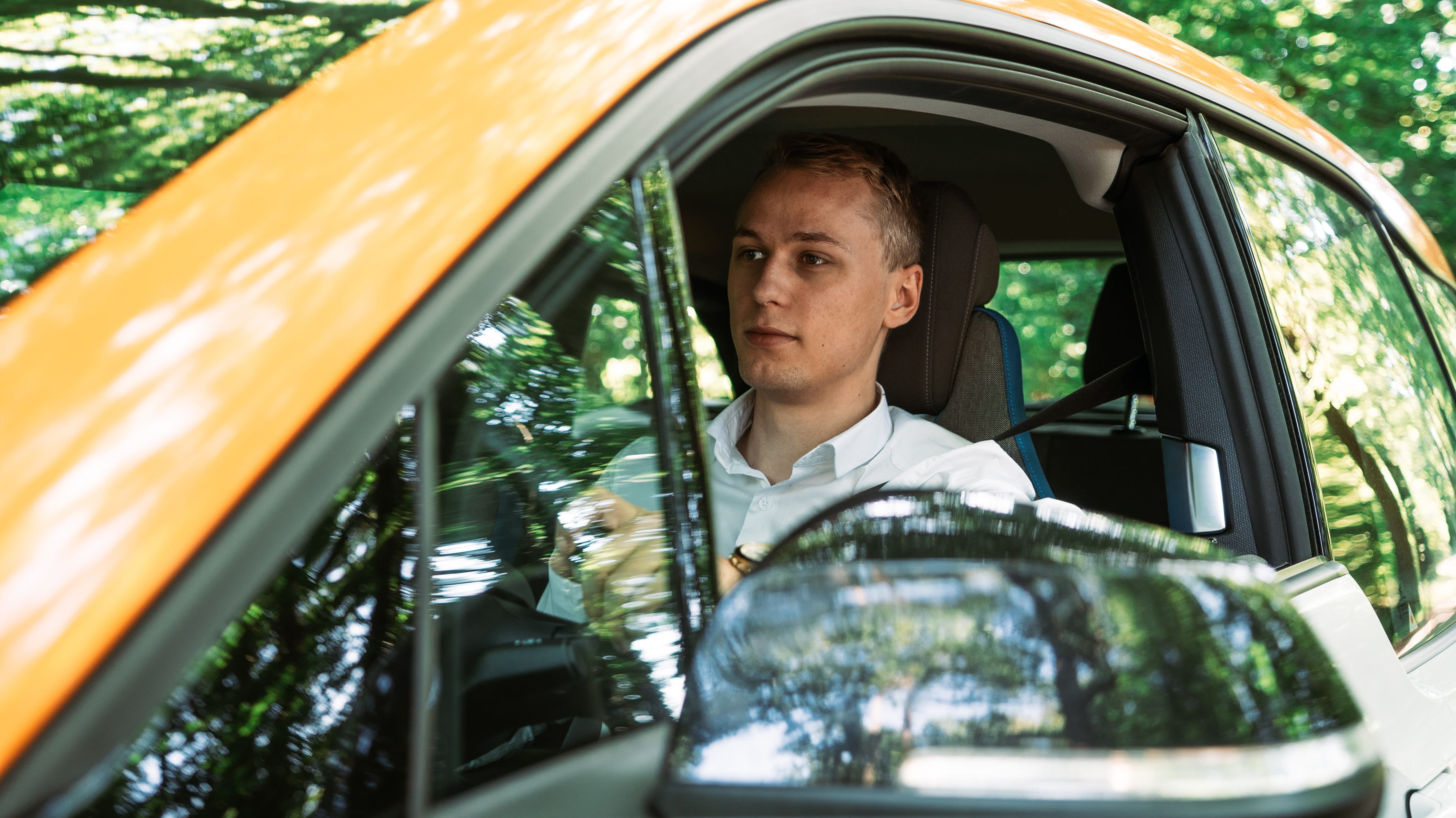 Photo of a teen driving a car.