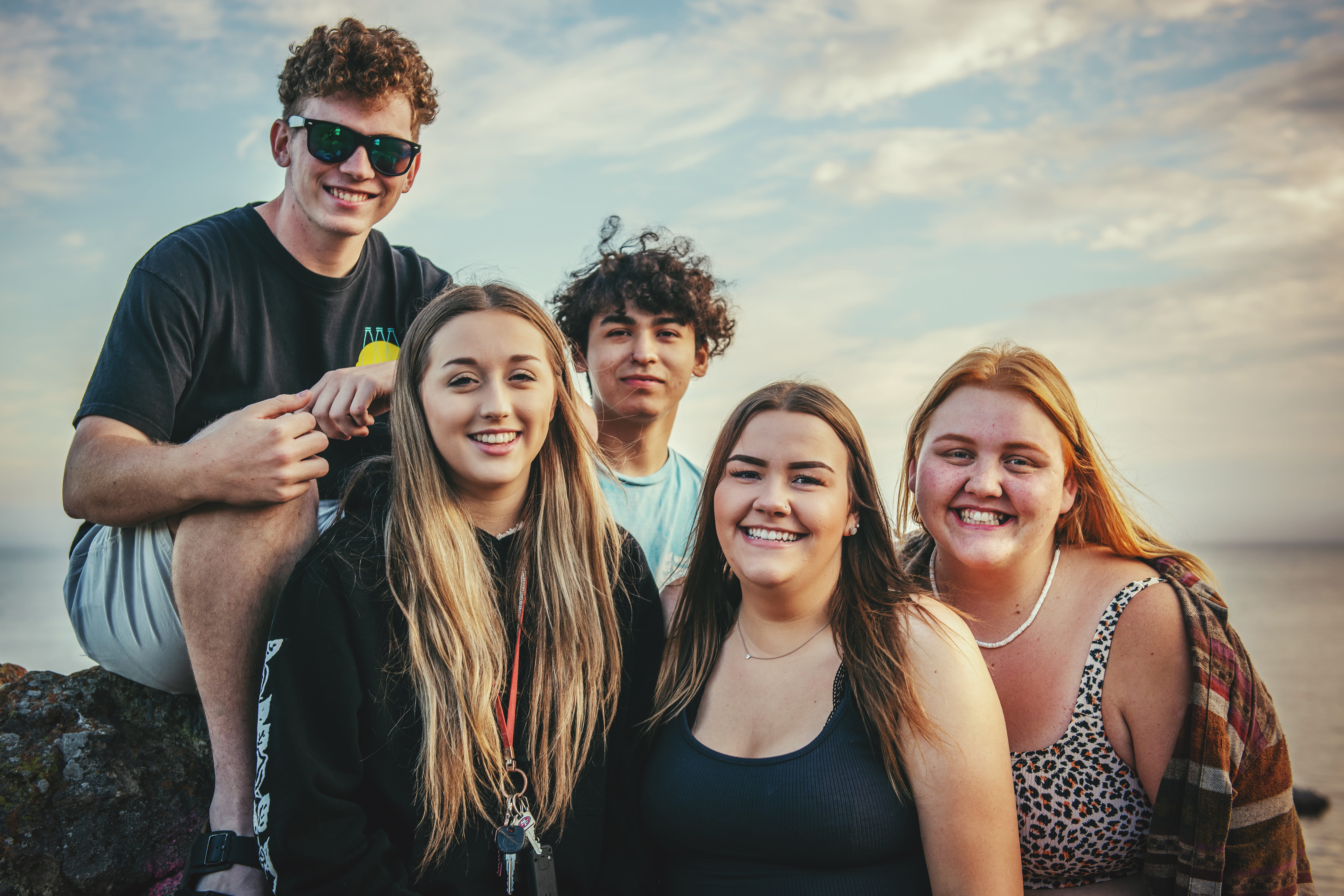 Photo of a group of teens by the lake.