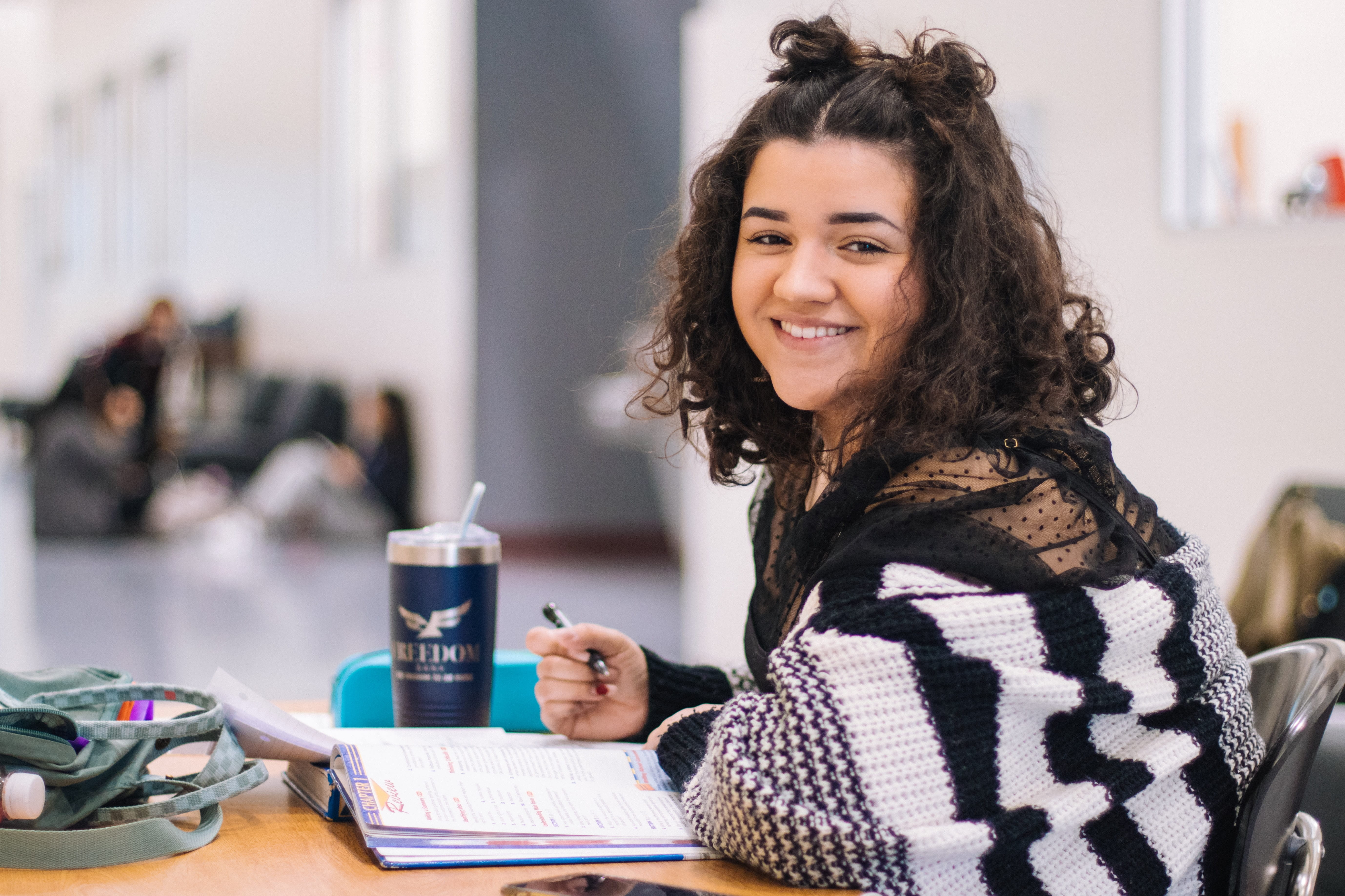 Photo of a woman doing homework.
