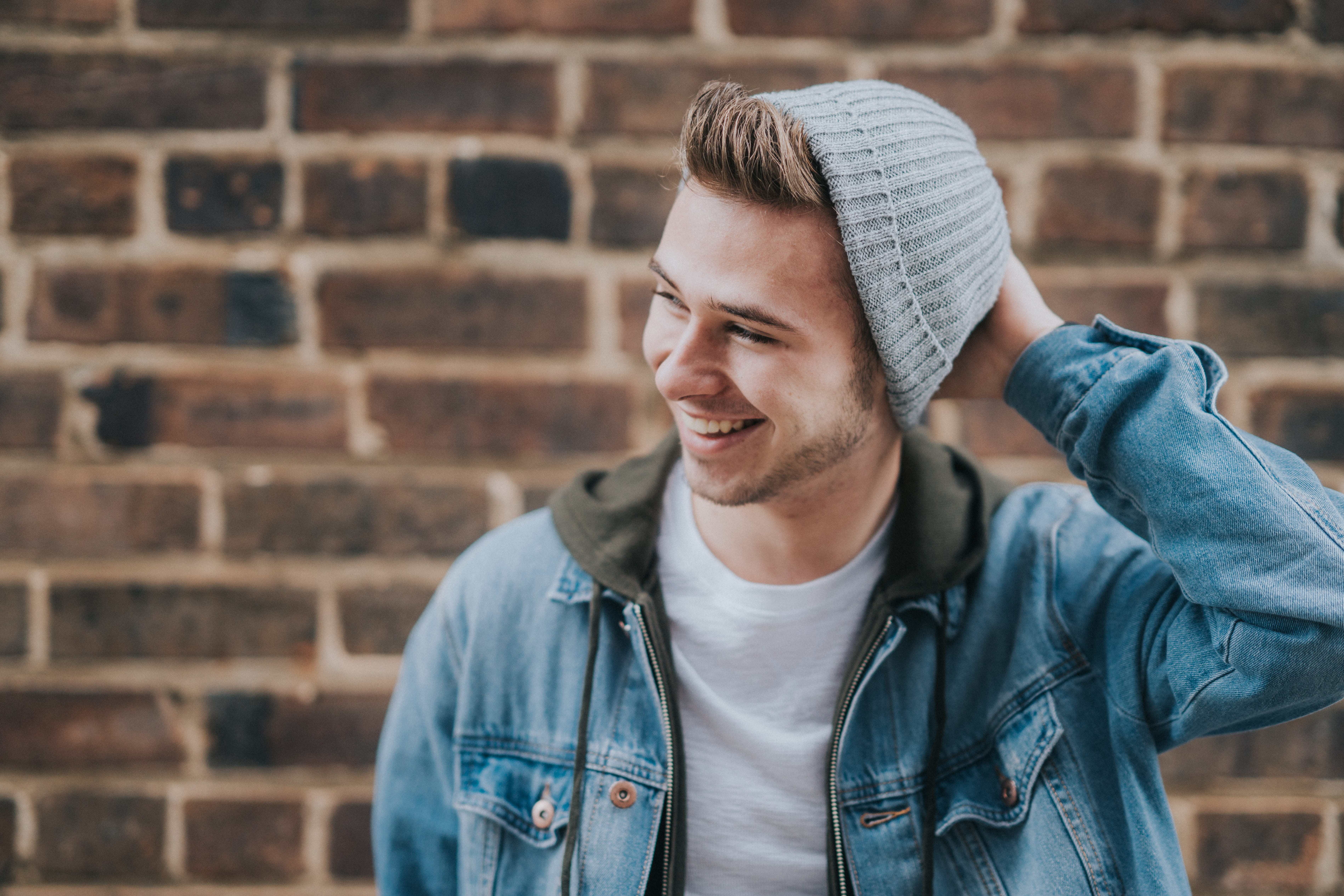 Photo of a male teen smiling.