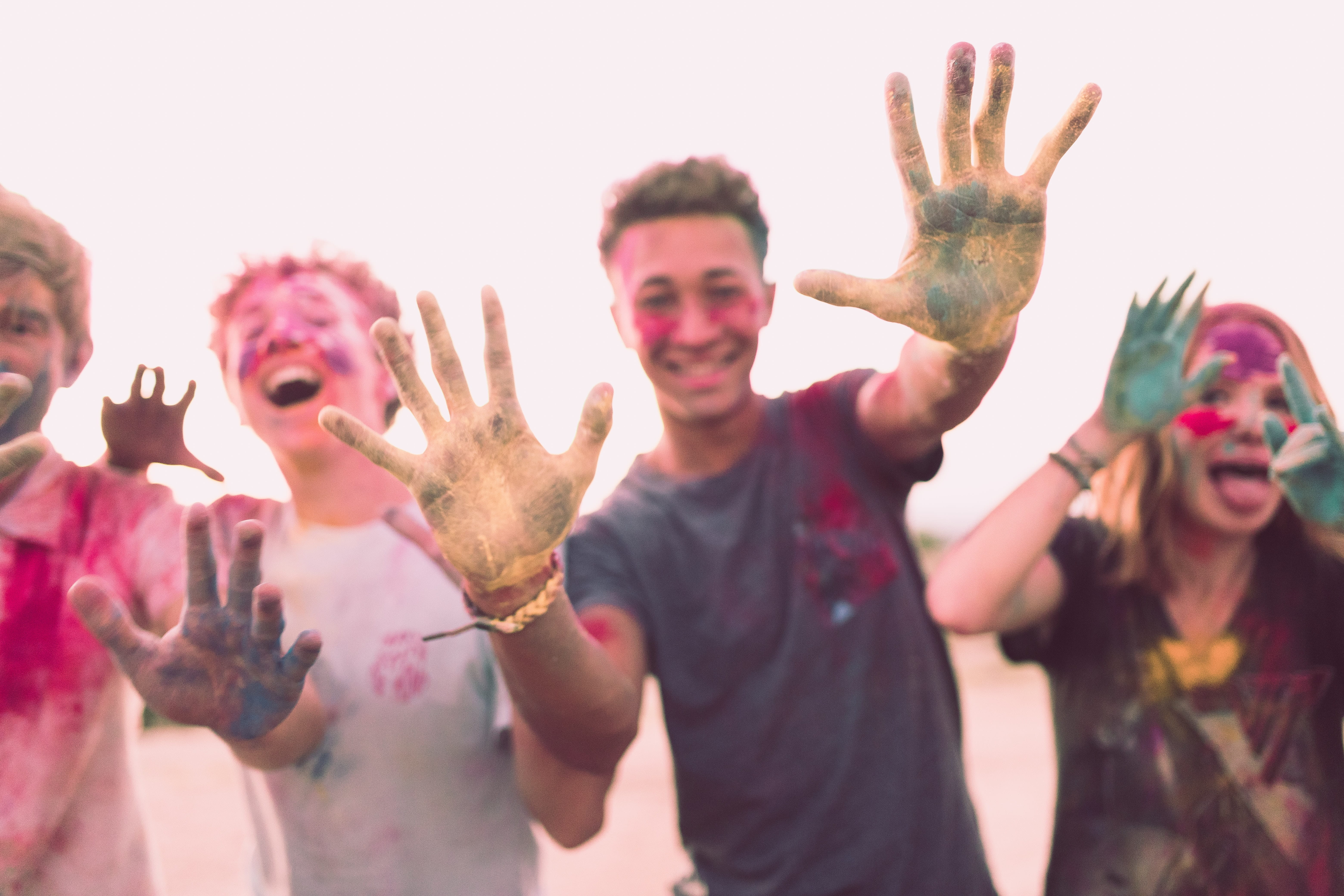 Photo of four teens after a color run.