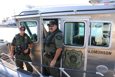 conservation officers on boat