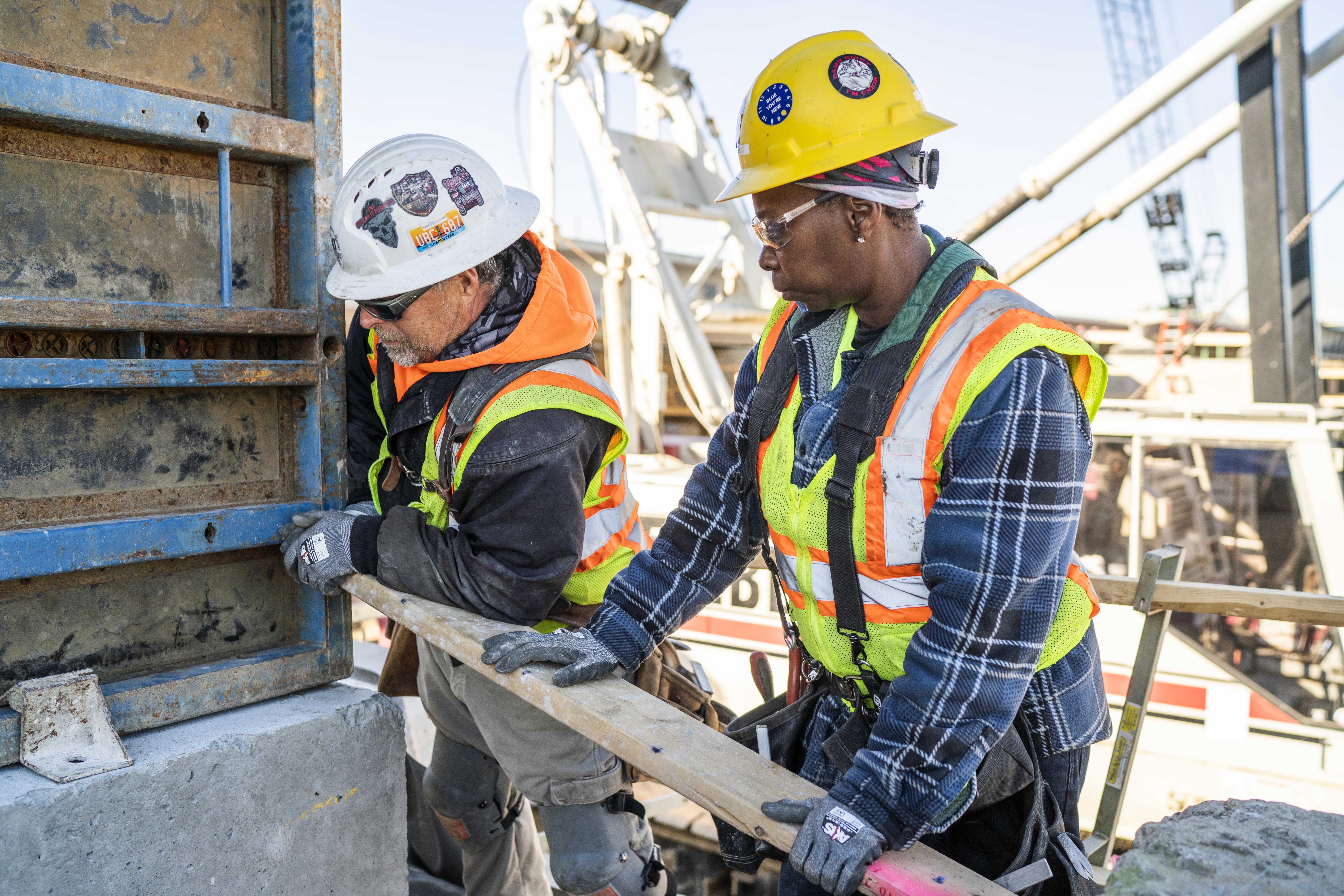 Union apprentice carpenter D'Juanna Ferrell works on construction site