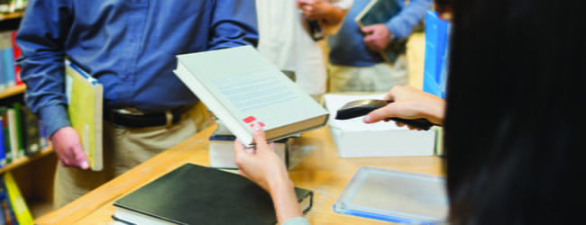 Library book being checked out