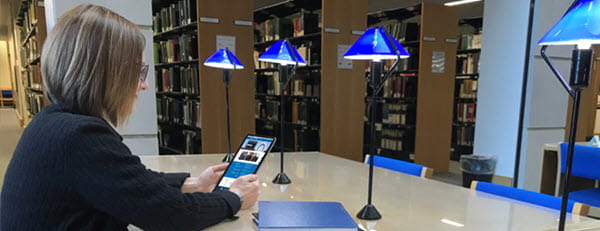 Patron at a Library of Michigan study table