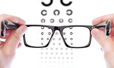 looking through glasses at an eye chart