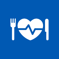 White heart-shaped plate, with fork on left and knife on right, on blue background