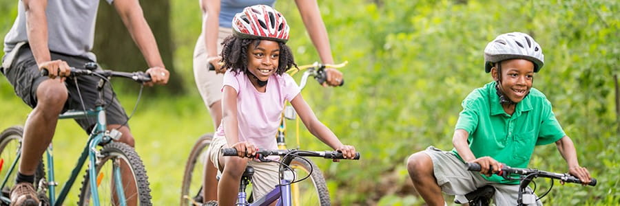 Family riding bikes together, Population Health