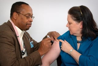 Woman receiving vaccination
