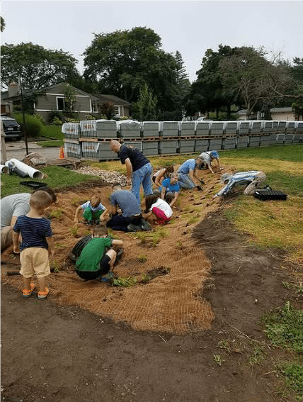 volunteers planting rain gardens