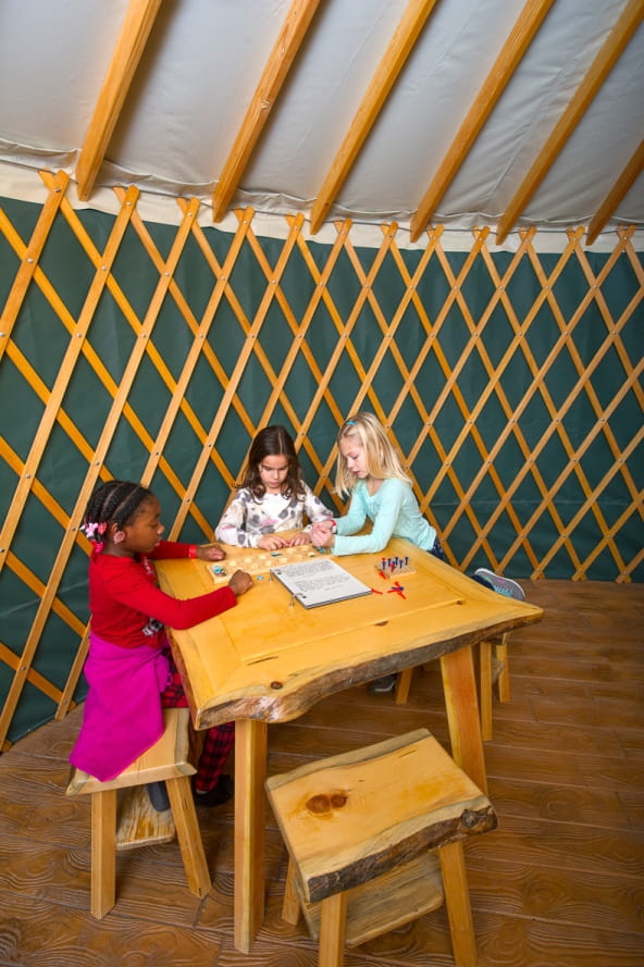 OAC girls playing in yurt