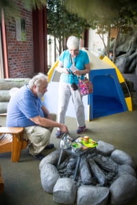 Older couple explores the campsite exhibit at the Outdoor Adventure Center. Older couple explores the campsite exhibit at the Outdoor Adventure Center.