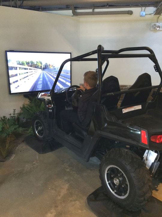 boy in OAC ORV simulator