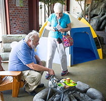 older couple checking out campsite exhibit at Outdoor Adventure Center older couple checking out campsite exhibit at Outdoor Adventure Center