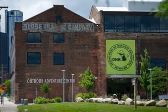 Back of the Outdoor Adventure Center, with the Globe Trading Company sign still visible on brick Back of the Outdoor Adventure Center, with the Globe Trading Company sign still visible on brick