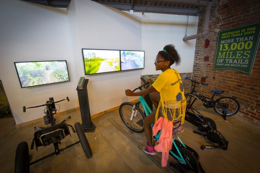 girl on OAC mountain bike simulator