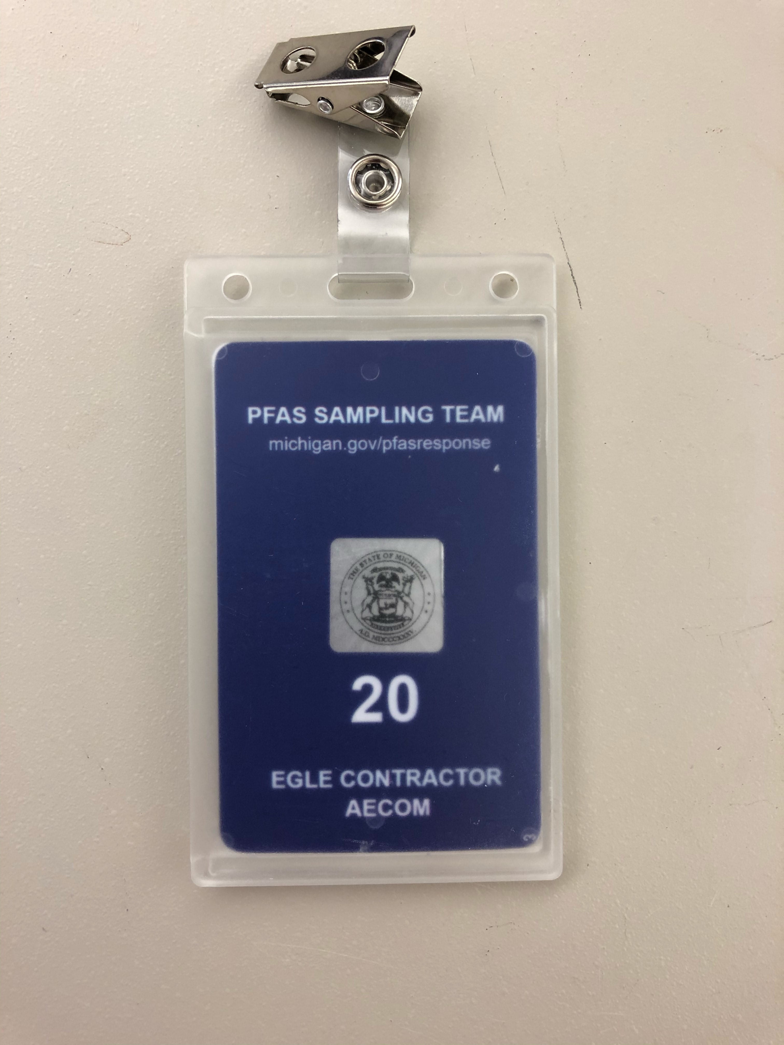 EGLE AECOM Contractor Badge: The badge is navy blue and states