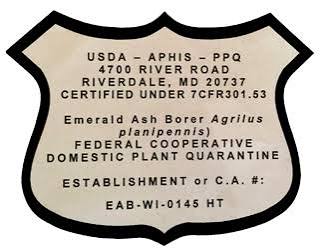 The USDA firewood certification shield, including the USDA-APHIS-PPQ address and firewood certification information.