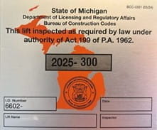 Orange State of Michigan Sticker with License Information