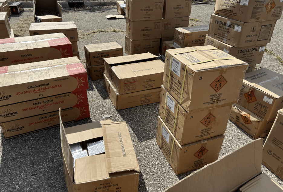 Photo of stacked boxes on pavement