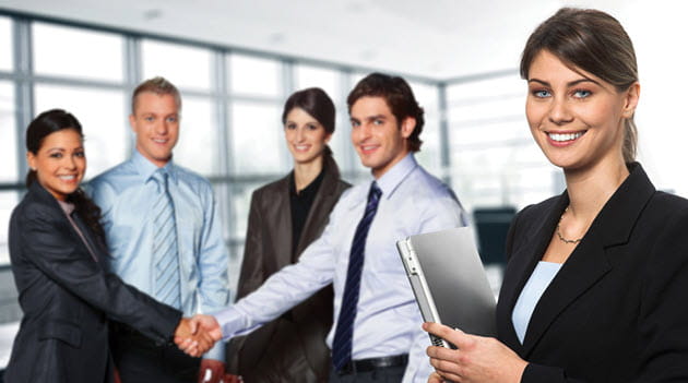 5 Professionals in a Group Setting Two Shaking are Shaking Hands