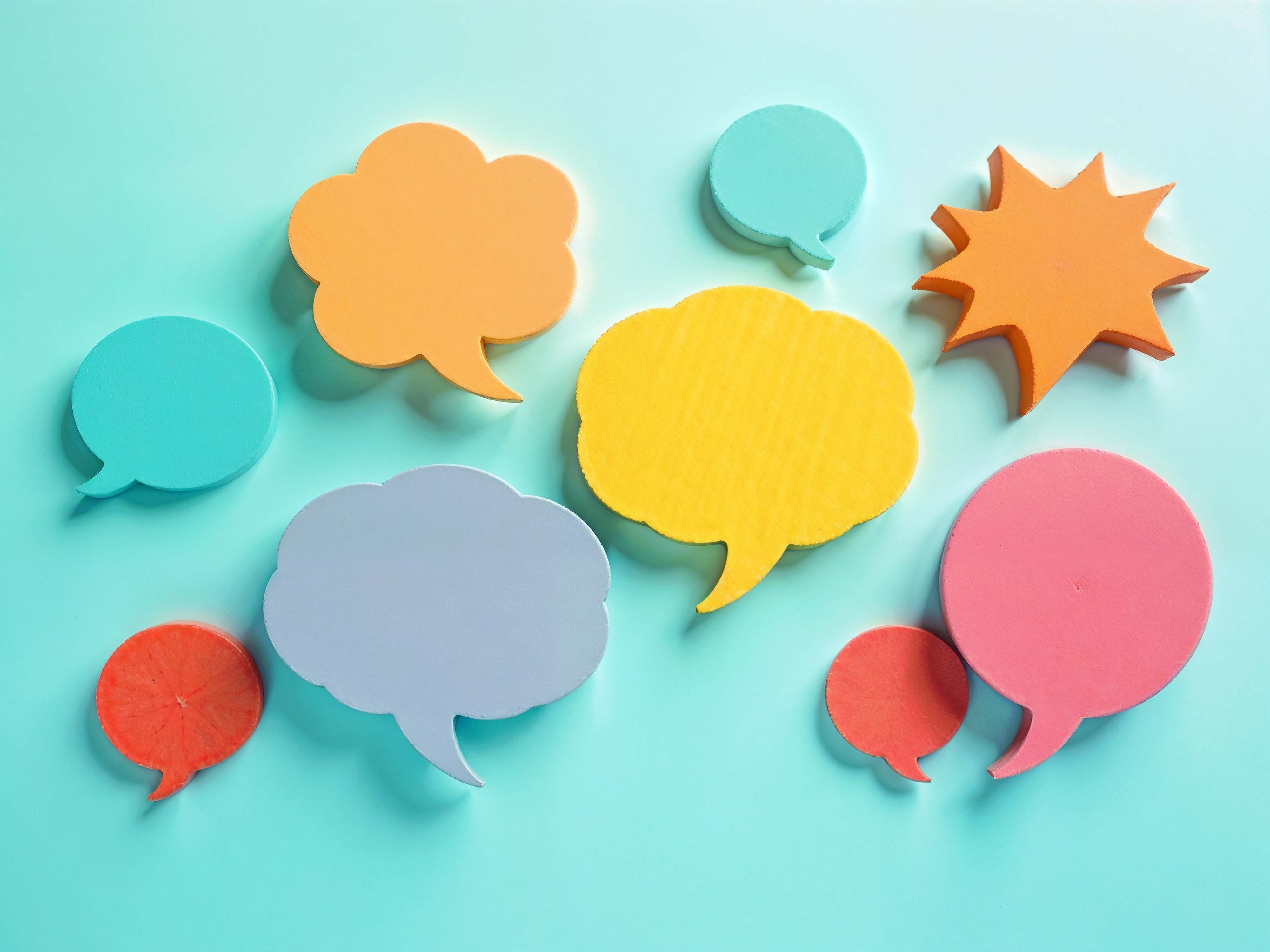 Colorful speech bubbles on light blue background