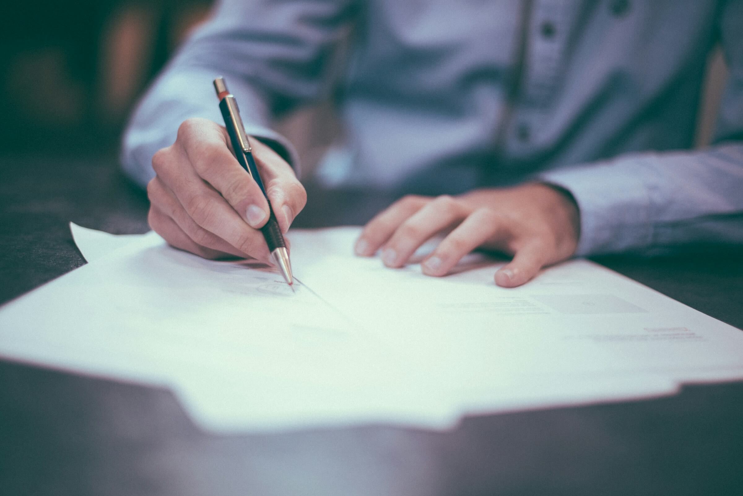 Man writing on a form