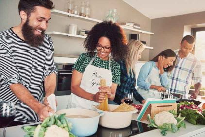 People in a Kitchen Cooking