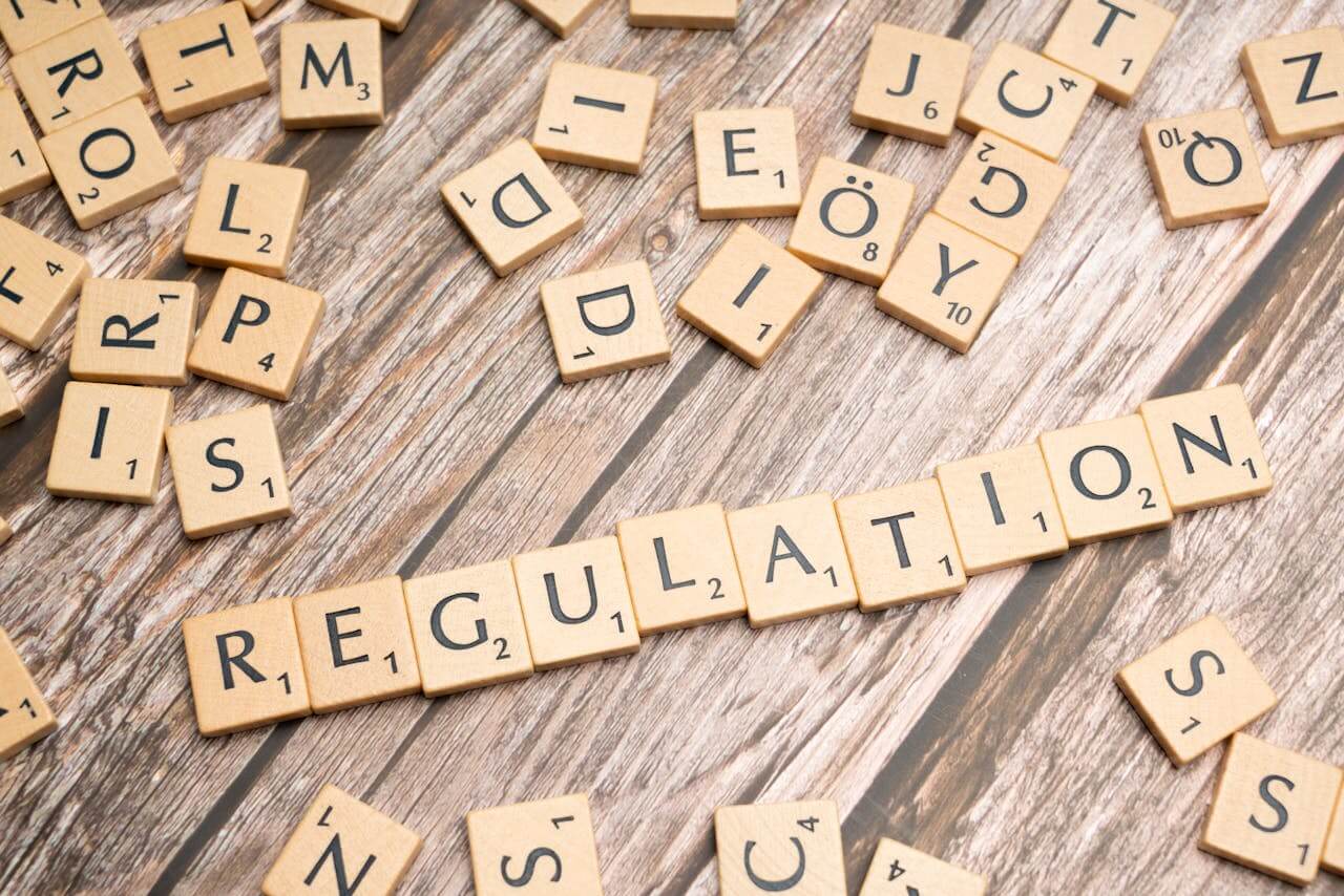 "Regulation" spelled out in letter tiles