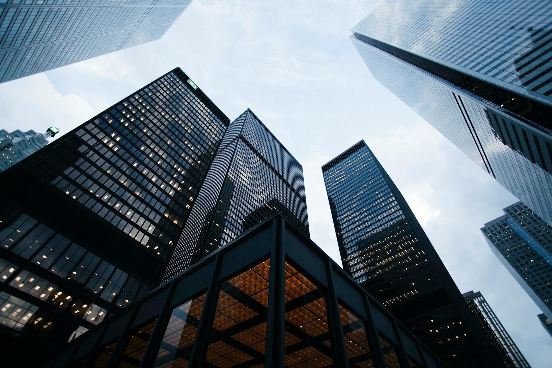 Person's eye view looking up at skyscrapers