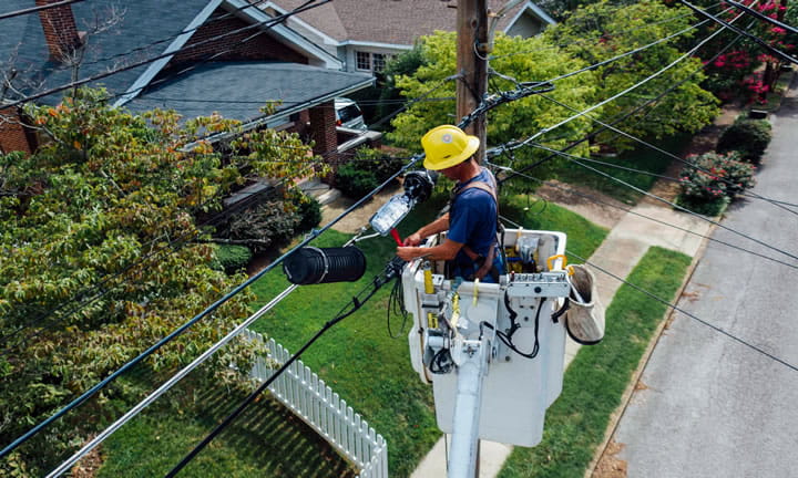 Construction worker on cherry picker
