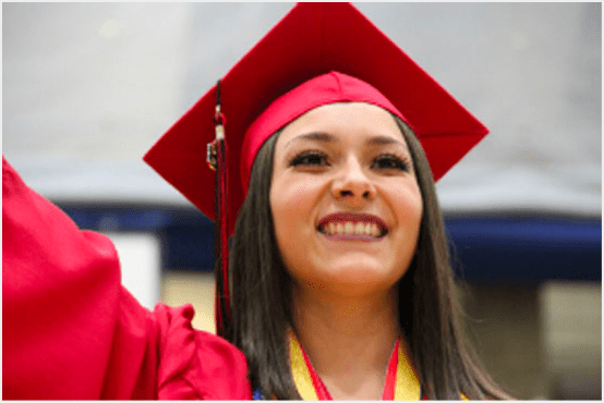 A student in her graduation cap and gown.