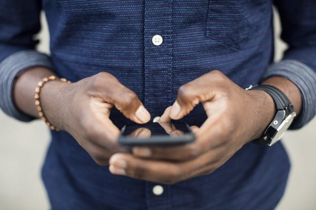 a man holding a cell phone