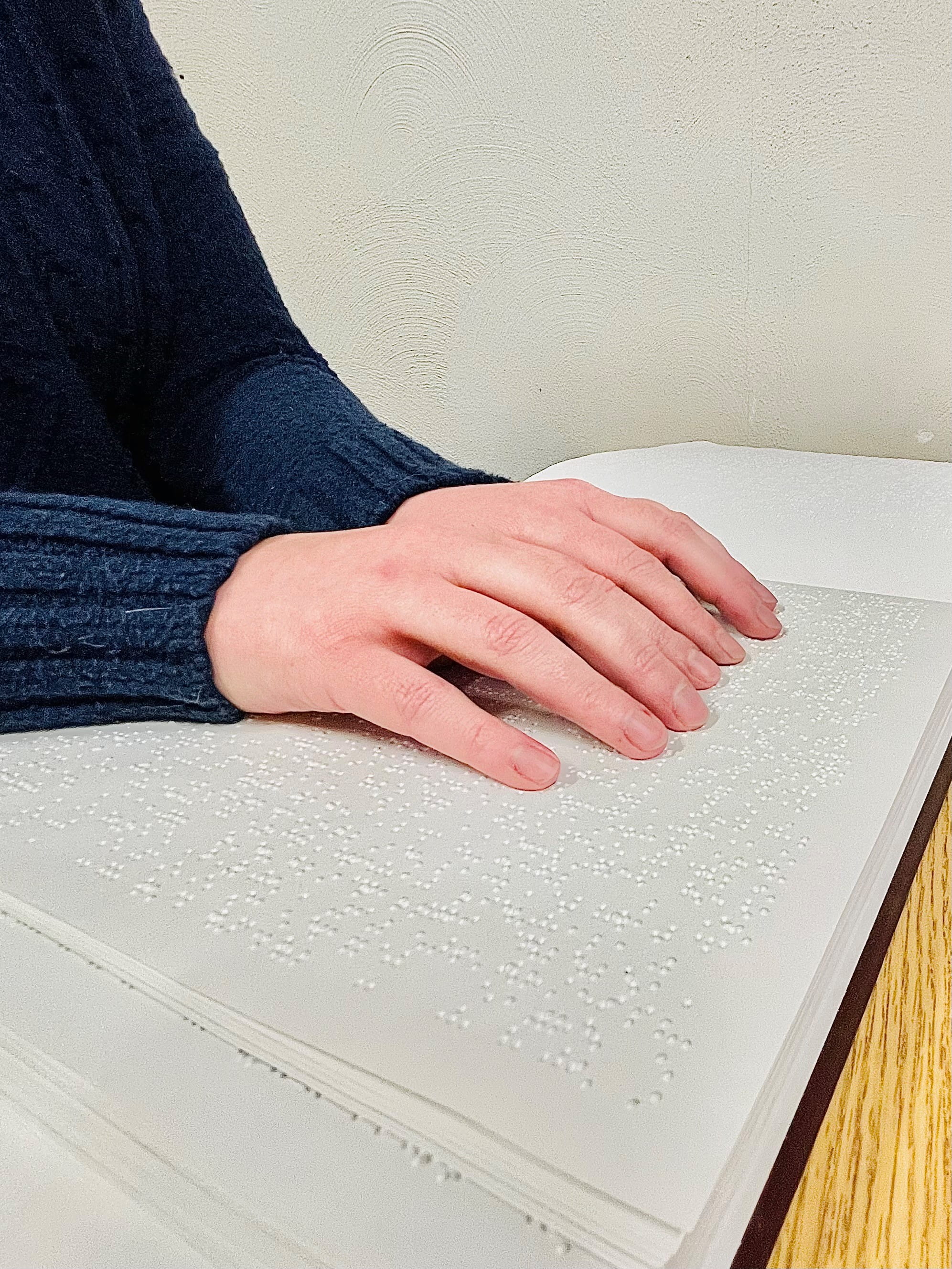 Person reading Braille