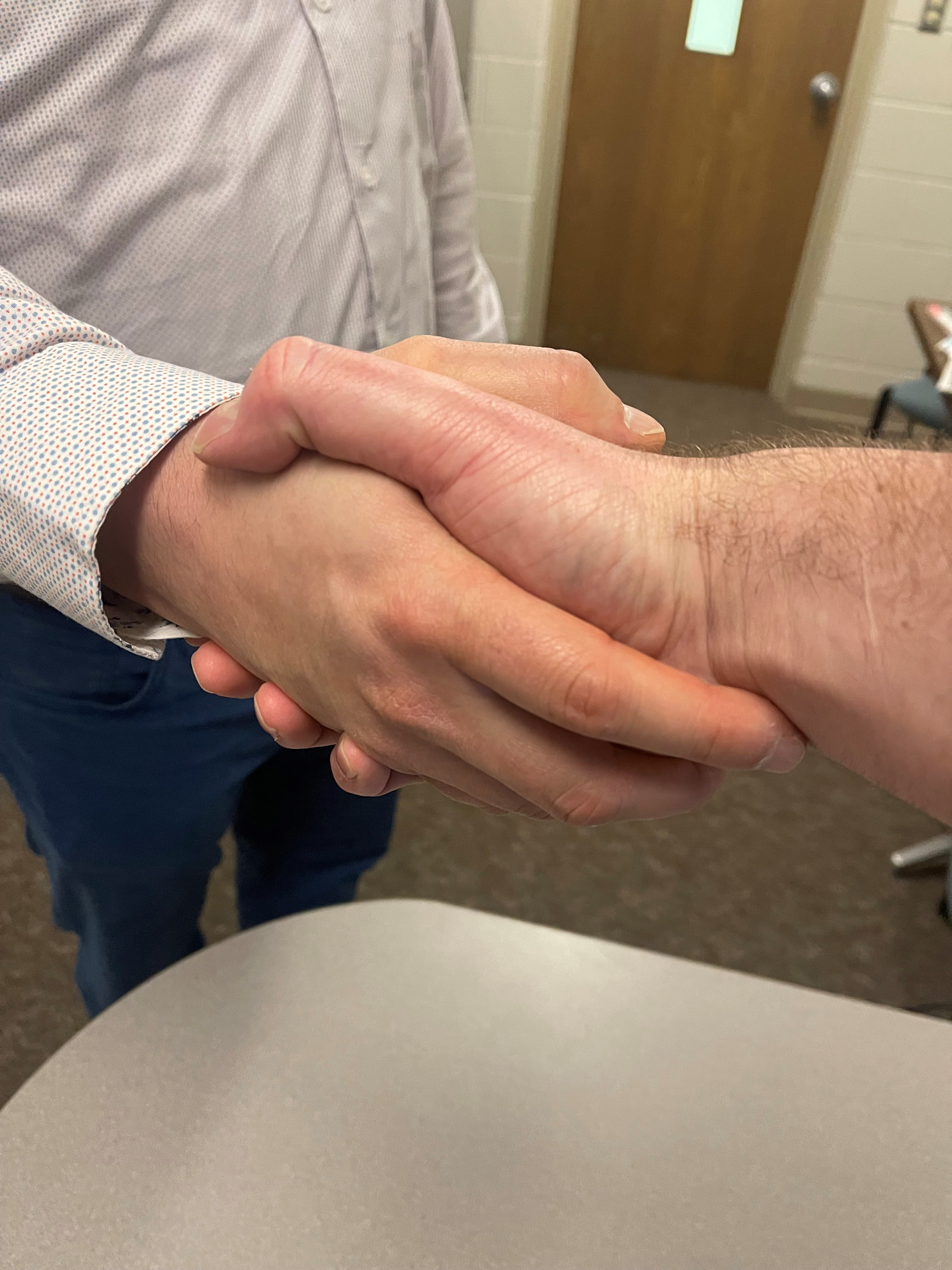 Two people shaking hands