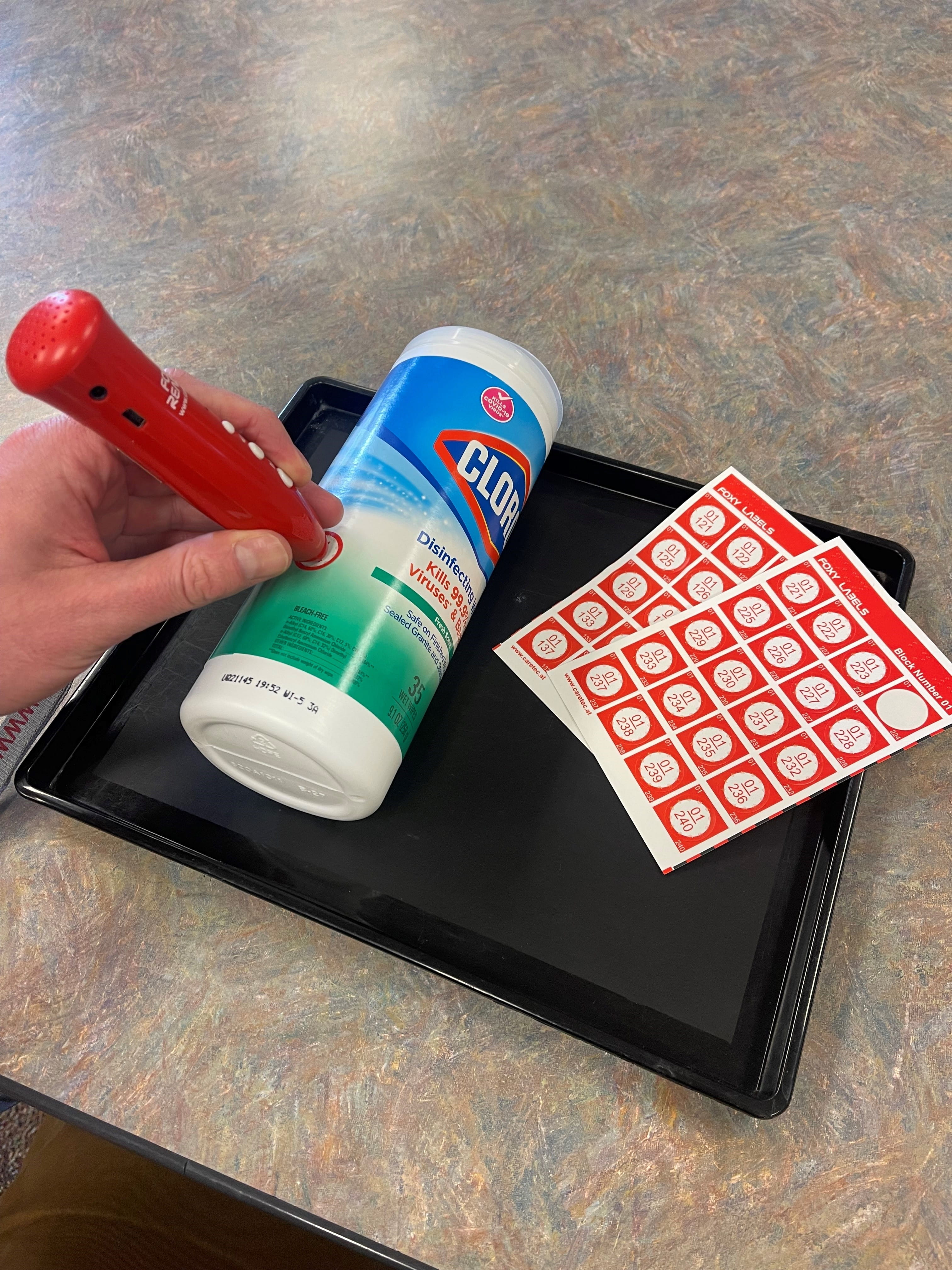 Person marking an item used for cleaning