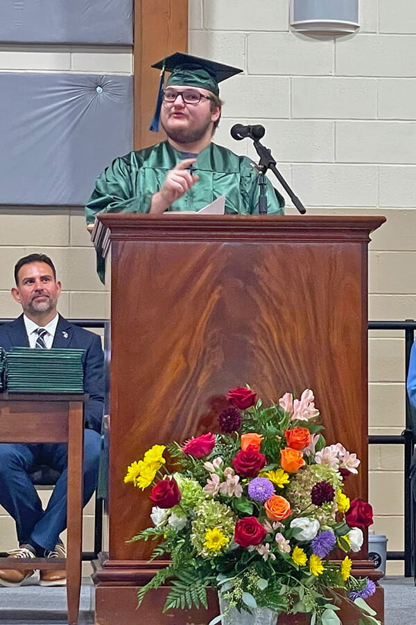 Trevor Sandborn of Kent County delivers the Student Address during Michigan Career and Technical Institute's 2024 summer/fall graduation ceremony.