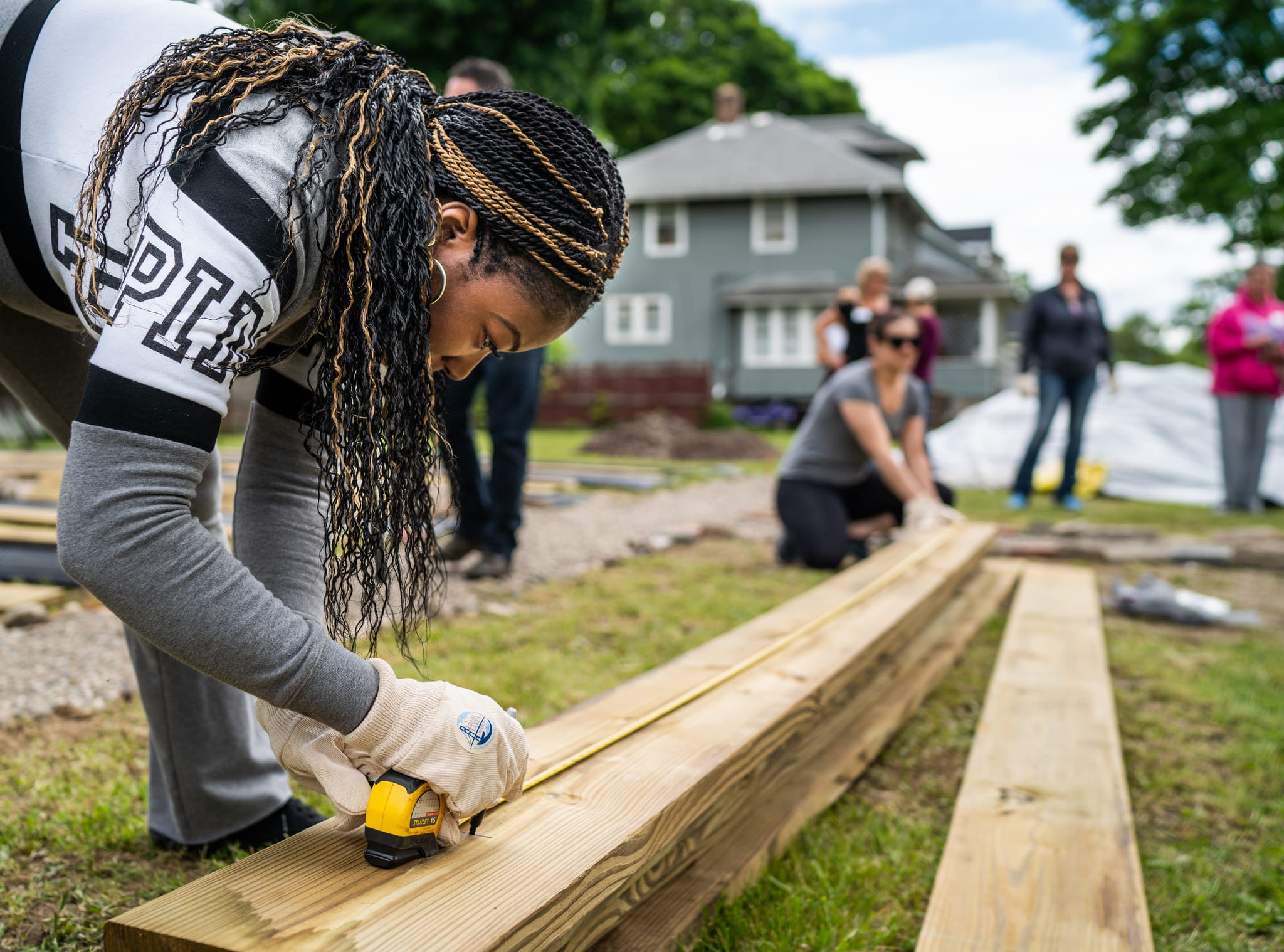 A group of people making a community garden.