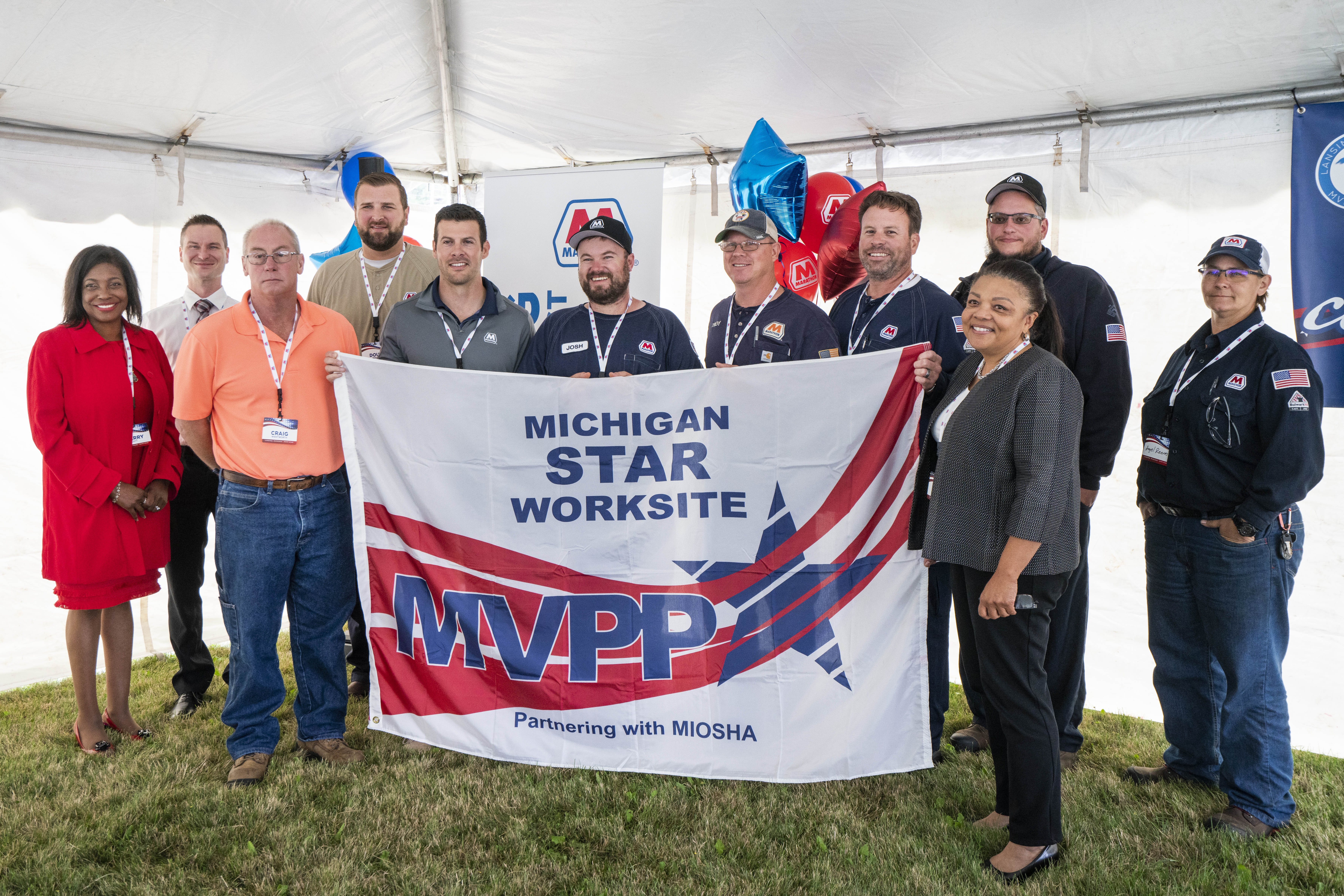 MIOSHA staff pose with Marathon Lansing Terninal and Fleet staff during a Michigan Voluntary Protection Program Star Award ceremony.