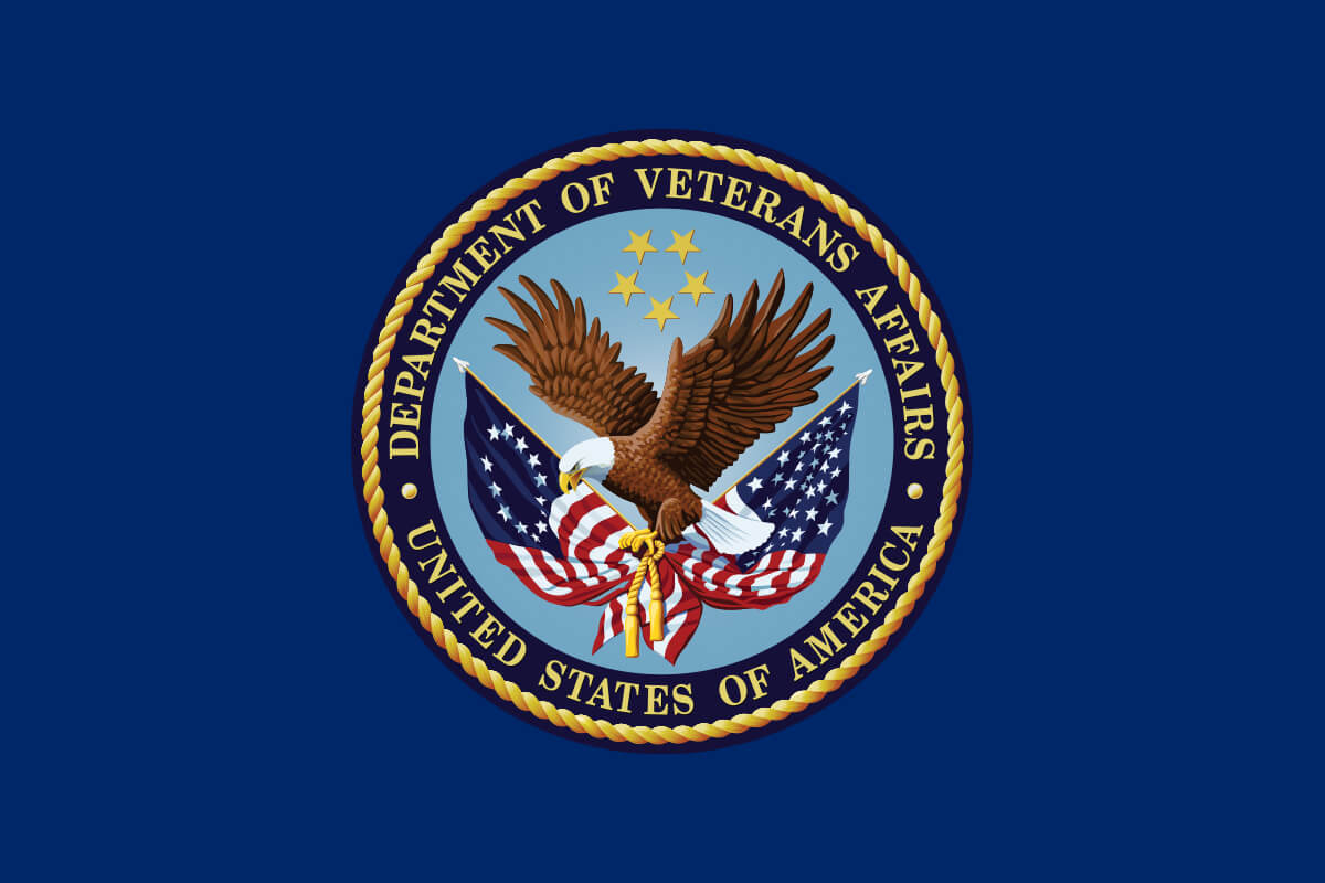 U.S. Department of Veterans Affairs seal with an eagle and American flags.