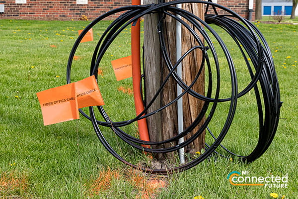 network cables gathered at the foot of a pole 