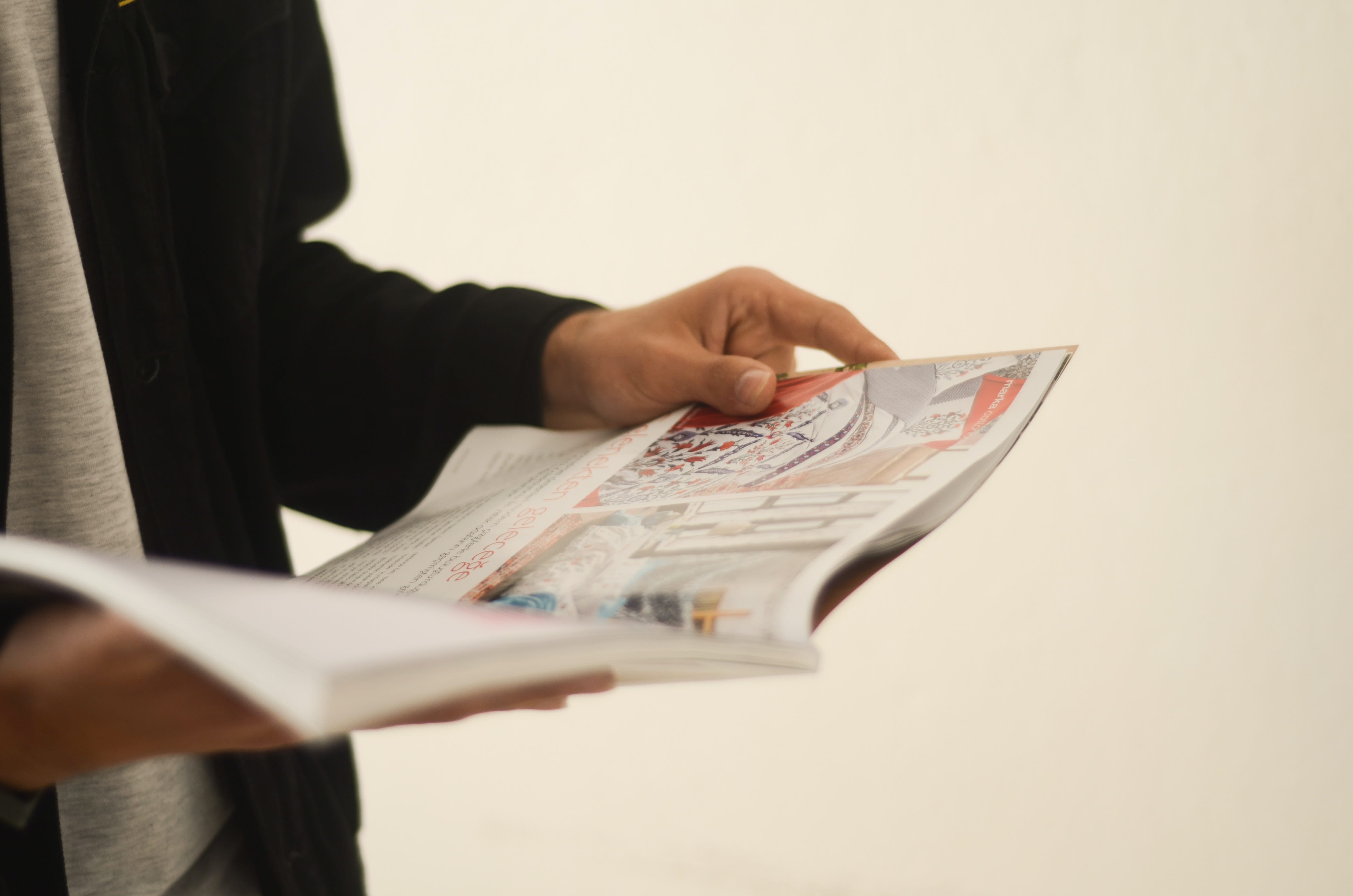 Person flipping through print publication