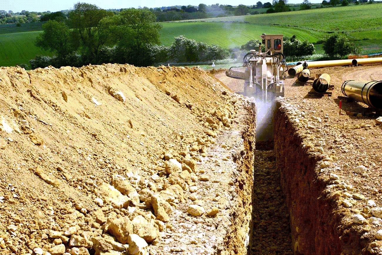 Construction machine digging a trench