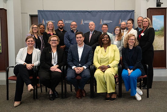 attendees of workforce development board meeting posing for group photo