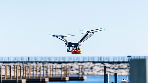 Drone flying with a boardwalk in the background