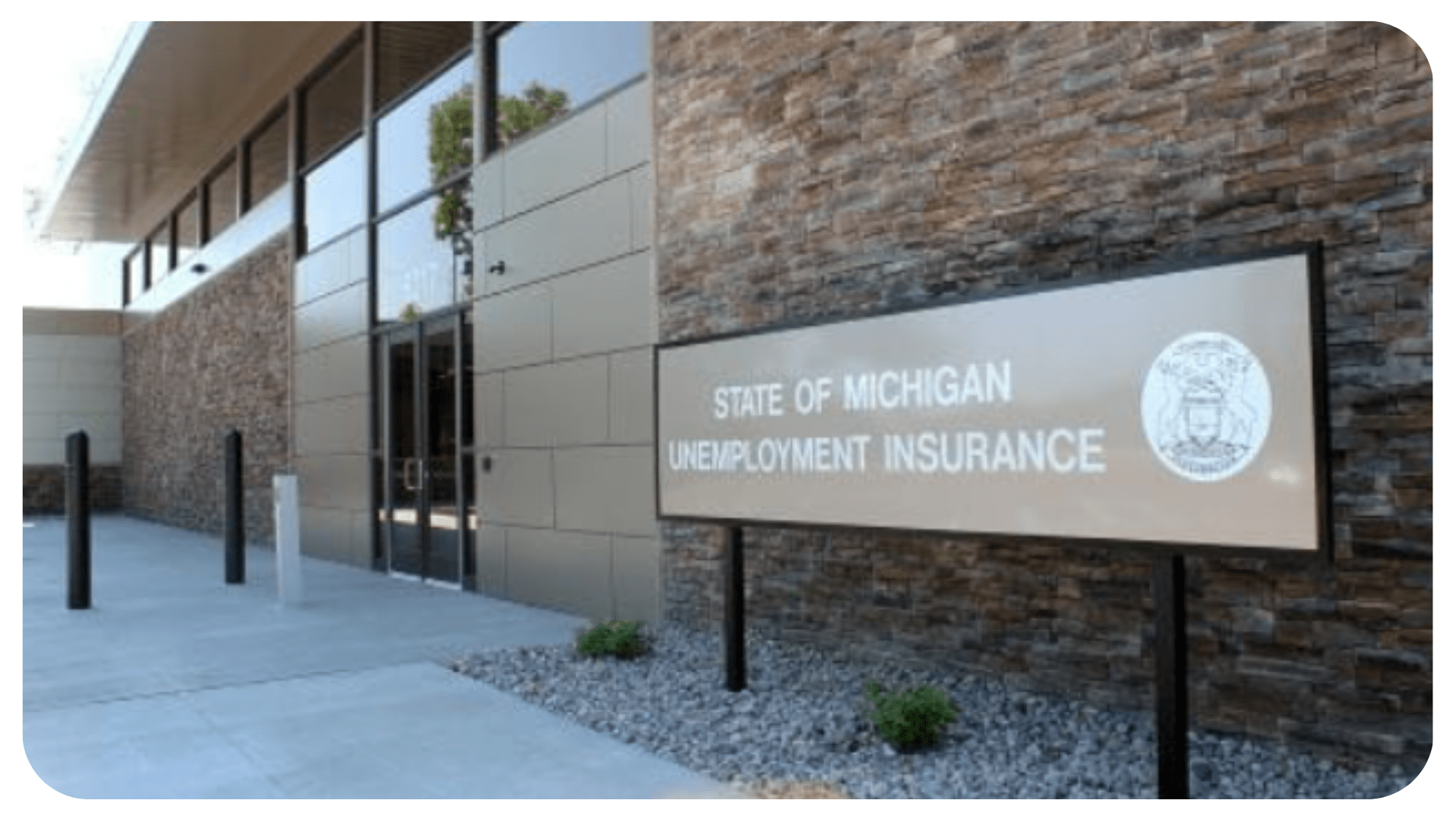 A sign focused outside a UIA building. The sign reads, "State of Michigan Unemployment Insurance"